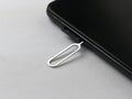 Sim card tray remover eject pin key tool and smartphone