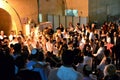 Jewish people celebrating Simchat Torah at western wall in the evening