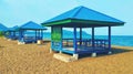 Similar blue gazebos with serene scenes along Morowali beach Royalty Free Stock Photo