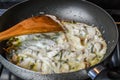 Simmering sliced onions, green peppers and chicken breasts with cooking cream Royalty Free Stock Photo