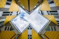 Simmetry Gleam between Yellow Cubic houses and apartments in Rotterdam. The Netherlands