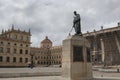 Simon Bolivar monument located at bolivar square in downtown city with nariÃÂ±o`s house and San Bartolome`s high school behind Royalty Free Stock Photo