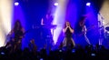 Simone Simons with her band in concert