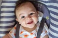 Simpatico baby smiling and happy in baby hammock Royalty Free Stock Photo