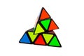 Simple abstract colorful pyramid triangular logical puzzle toy object isolated on white, displaced elements, creativity