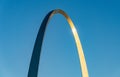 Unusual view of Gateway Arch at sunrise against blue sky Royalty Free Stock Photo