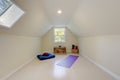 Simple attic room with yoga and meditation set up