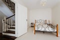 Simple bedroom and wooden stairs