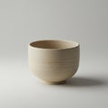 A simple beige ceramic bowl with a smooth, unglazed surface sits on a neutral Royalty Free Stock Photo