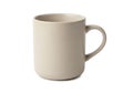 A simple beige ceramic mug with a sleek and minimalist design Royalty Free Stock Photo