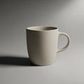 Simple, beige ceramic mug with a smooth texture is positioned on a Royalty Free Stock Photo