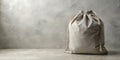 Simple beige drawstring bag on neutral background for mockup designs. Generative AI Royalty Free Stock Photo