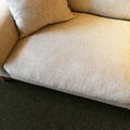 Simple beige sofa with cushion