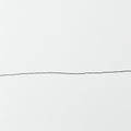 A simple black line runs horizontally across a textured white background, creating a Royalty Free Stock Photo