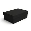 Simple black rectangular box on a plain surface Royalty Free Stock Photo