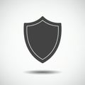 Simple black shield icon against a light gray background. The shield has a classic, Royalty Free Stock Photo