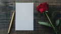Simple Blank Note Paper with Red Rose and Pencil on Wooden Table Royalty Free Stock Photo