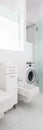 Simple bathroom with washing machine Royalty Free Stock Photo