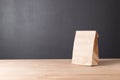 simple brown paper bag for lunch or food on table Royalty Free Stock Photo