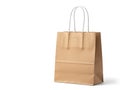Simple brown paper bag with white handles Royalty Free Stock Photo
