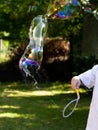 Simple bursting soap bubble outside, high shutter speed. Bubble bursts outside in mid air, frozen motion Failing, psychology Royalty Free Stock Photo