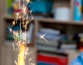 Simple cake sparkler sparkling candle at home closeup high shutter speed macro light blur. Birthday party detail sparks flying