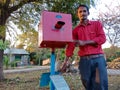 simple camera science model project displayed by Asian man at green park in India January 2020