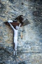 Simple catholic crucifix on a granite wall