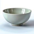 Simple ceramic bowl on a plain surface studio setting Royalty Free Stock Photo