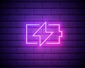 Simple charge battery, charging level. Neon style. Light decoration icon. Bright electric symbol isolated on brick wall