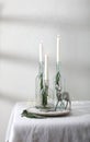 Simple Christmas, New Year composition, centrepiece with candles and deer on the table. Royalty Free Stock Photo