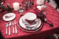 Elegant Christmas Placesetting with red tablecloth and Plaid napkins