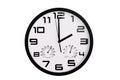 Simple classic black and white round wall clock isolated on white. Clock with arabic numerals on wall shows 14:00 , 2:00