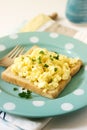 Simple classic breakfast of bread toast and scrambled eggs with parsley. Royalty Free Stock Photo