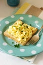 Simple classic breakfast of bread toast and scrambled eggs with parsley. Royalty Free Stock Photo