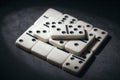 simple classic domino tiles in white on a dark background