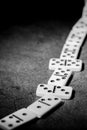 simple classic domino tiles in white on a dark background