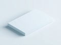Minimalist white rectangular block casting a soft shadow on a clean, light blue background Royalty Free Stock Photo