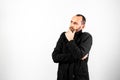 Simple and clean portrait with negative space of thoughtful and worried middle-aged man