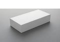 A simple clean white rectangular box sits on a plain gray surface with subtle shadow Royalty Free Stock Photo