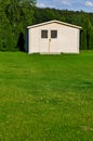 New garden house or shed in green lawn or grass Royalty Free Stock Photo