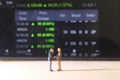 Conceptual Photo, Illustration for Senior Investor Mini Figure Toy Standing 2 businessman Handshaking and watching Running