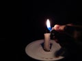 Very Simple Conceptual Photo, Man`s Right Hand Firing White Flaming Candle at black background for your element design