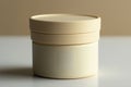 A modern, minimalist cream container on a neutral background showcasing simple design aesthetics Royalty Free Stock Photo