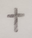 Simple cross symbol, pencil drawing on paper.