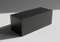 A simple dark gray rectangular prism casting a shadow isolated on white background Royalty Free Stock Photo