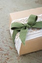 Simple decorative gift box wrapped in brown eco paper and lace Royalty Free Stock Photo