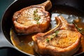 Simple and delicious pan fried pork chops in sizzling butter with thyme. Traditional American cuisine dish specialty Royalty Free Stock Photo