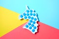 Simple dimple in form unicorn on colorful yellow, red and blue background.