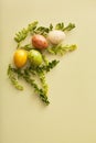 simple easter composition on a green background. flat lay with space for text